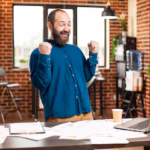 businessman-clenching-fists-triumph_482257-119272