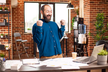 businessman-clenching-fists-triumph_482257-119272